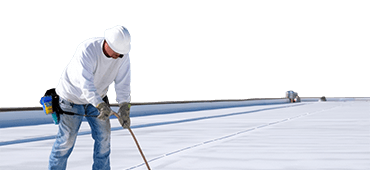 Worker applies an insulation coating on the concrete surface of a rooftop. Repairman fixing a leaking roof or deck by applying waterproofing solution