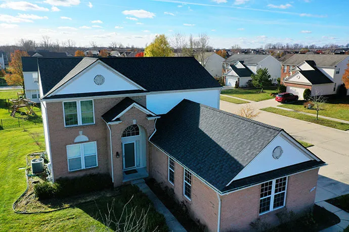 Drone view of home with new black roof