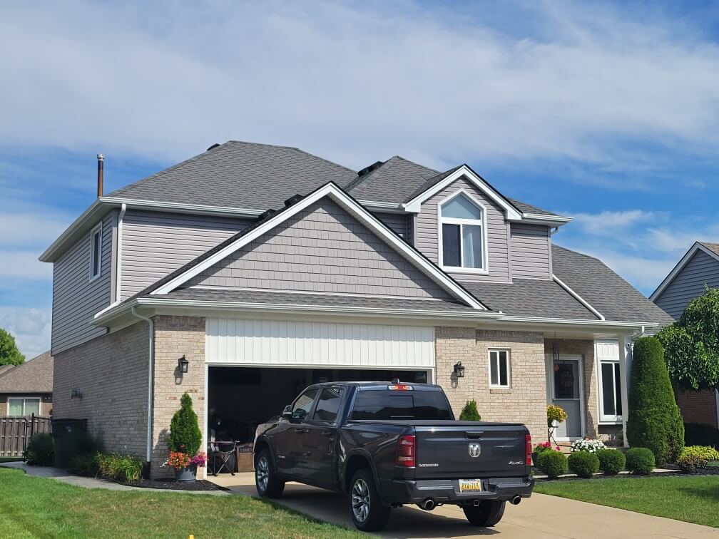 Home with new gray vinyl siding