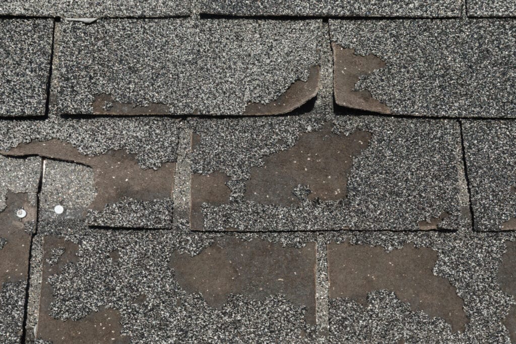 A roof with shingles that have missing granules/granule loss