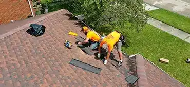 L&S Roofing contractors repairing a residential roof