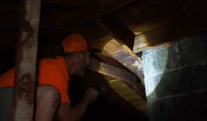 Matt from L&S Home Improvements is performing an attic inspection