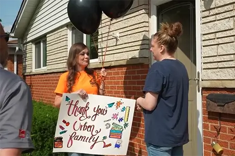Woman receiving a new roof from L&S Home Improvements