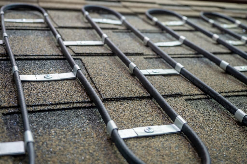 Heat cables nailed to a roof