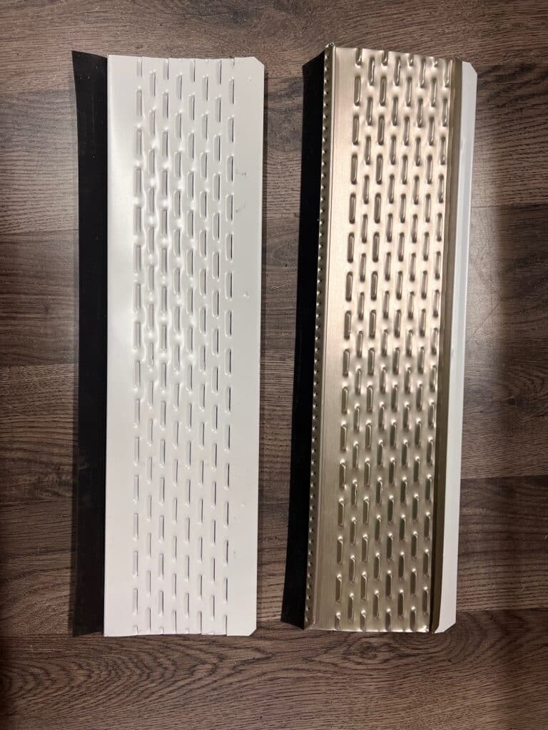 The top and bottom of a new metal perforated gutter guard