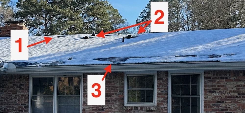 A home with a snowy roof. There are numbered boxes pointing to areas where the snow is melting faster