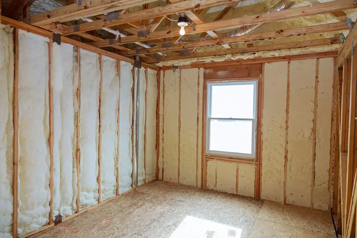 Insulation of attic with fiberglass cold barrier and insulation material