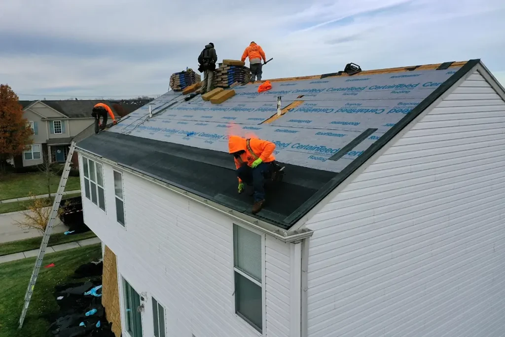 Done view of L&S Home Improvements workers installing a new roof on a home
