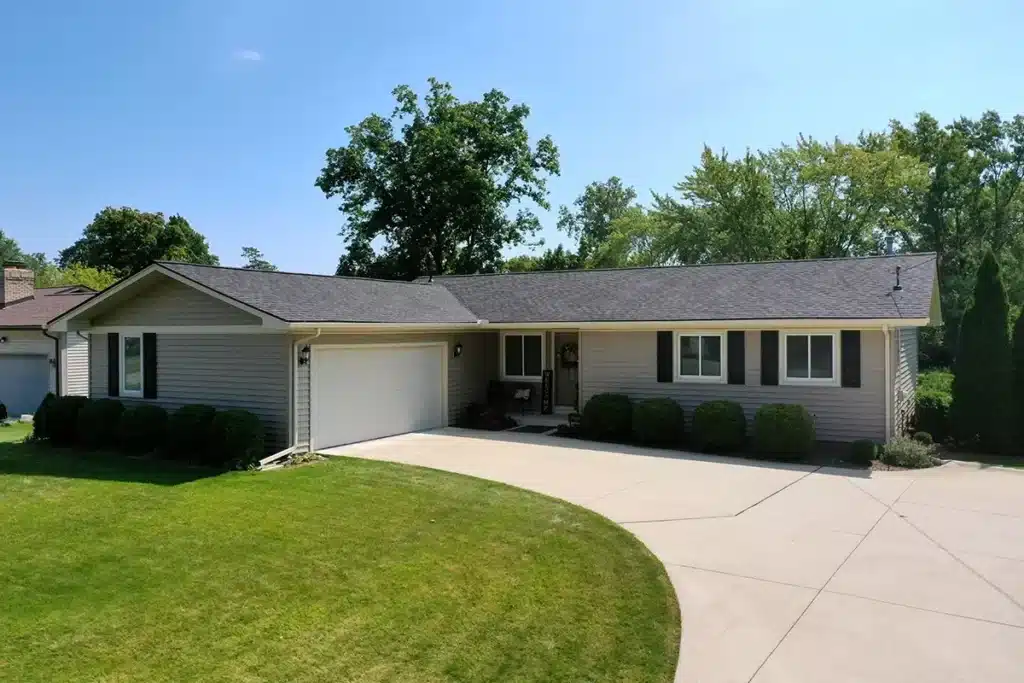 The front of a one-story home with new siding