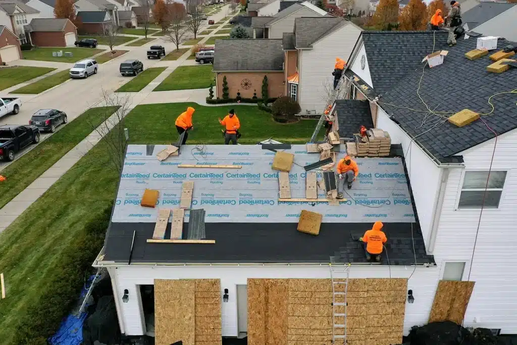 Done view of L&S Home Improvements workers installing a new roof on a home