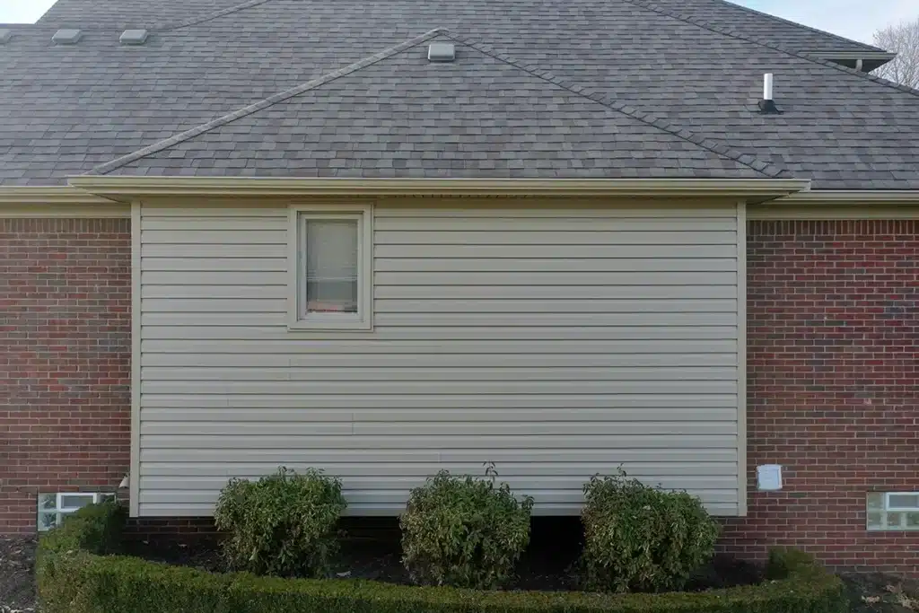 The side of a two-story home with new siding