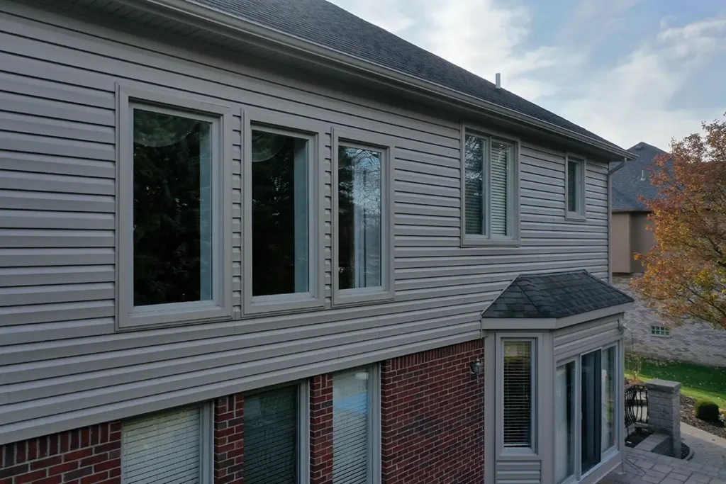 The back of a two-story home with new siding