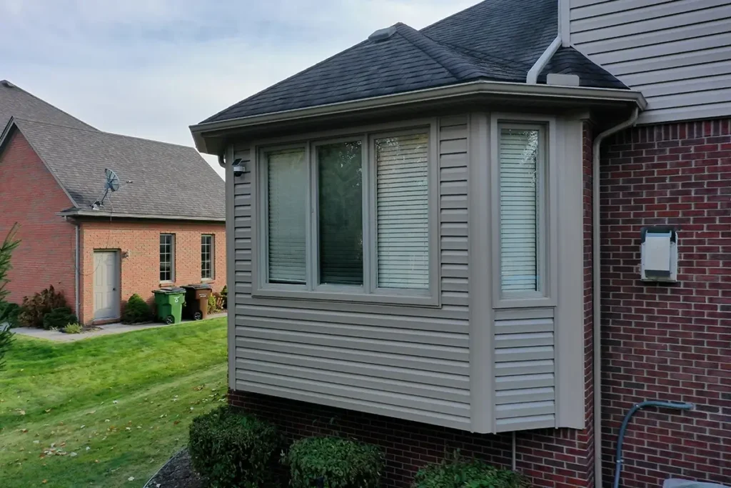 The back of a two-story home with new siding