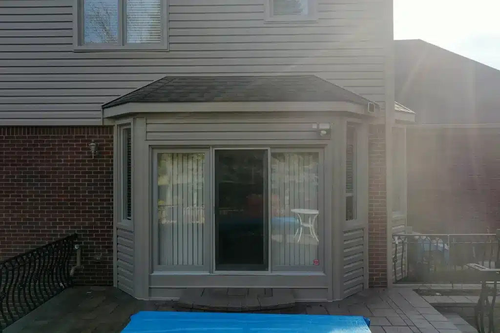 The back of a two-story home with new siding
