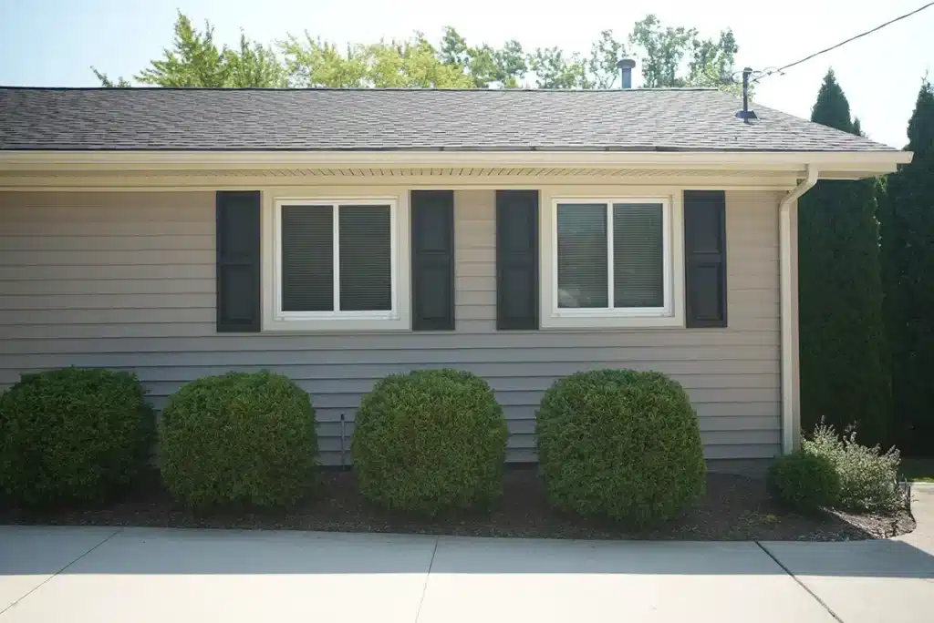 The side of a one-story home with new siding