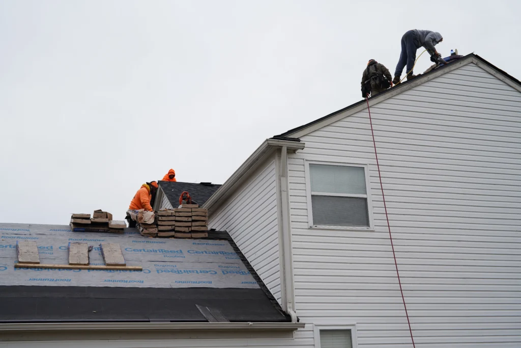 L&S Home Improvements workers installing a new roof on a home