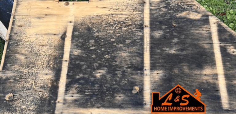 Rotted wood deck with L&S's logo in the corner