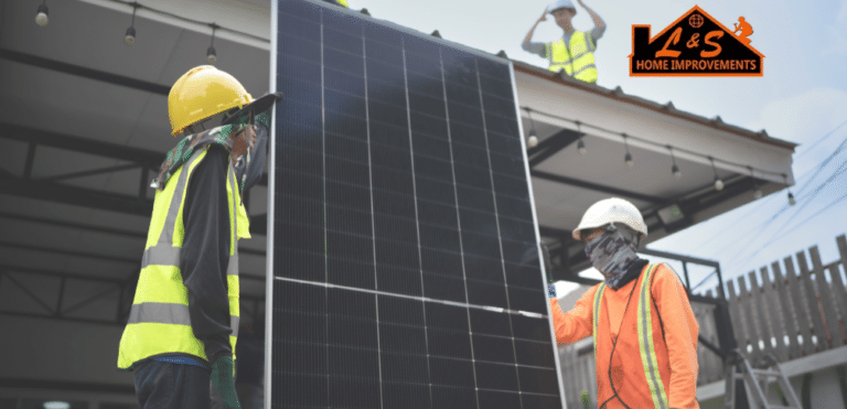 Installers carrying a solar panel from the ground, preparing to install it on a roof