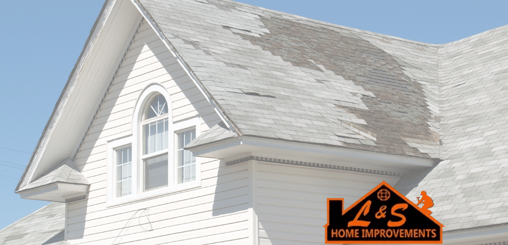 A roof with several missing shingles